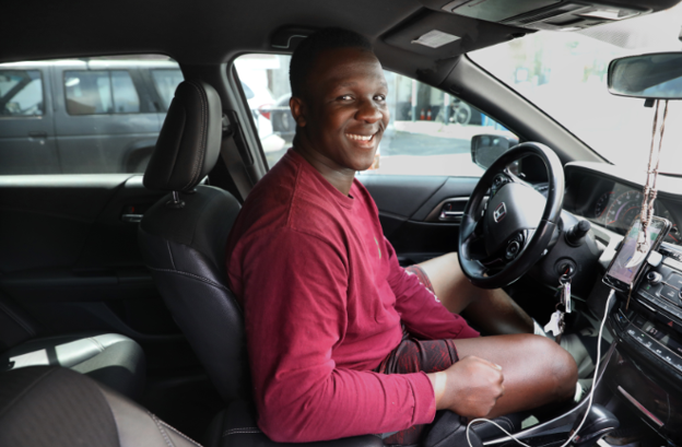 TripCity driver reviewing earnings dashboard on mobile device